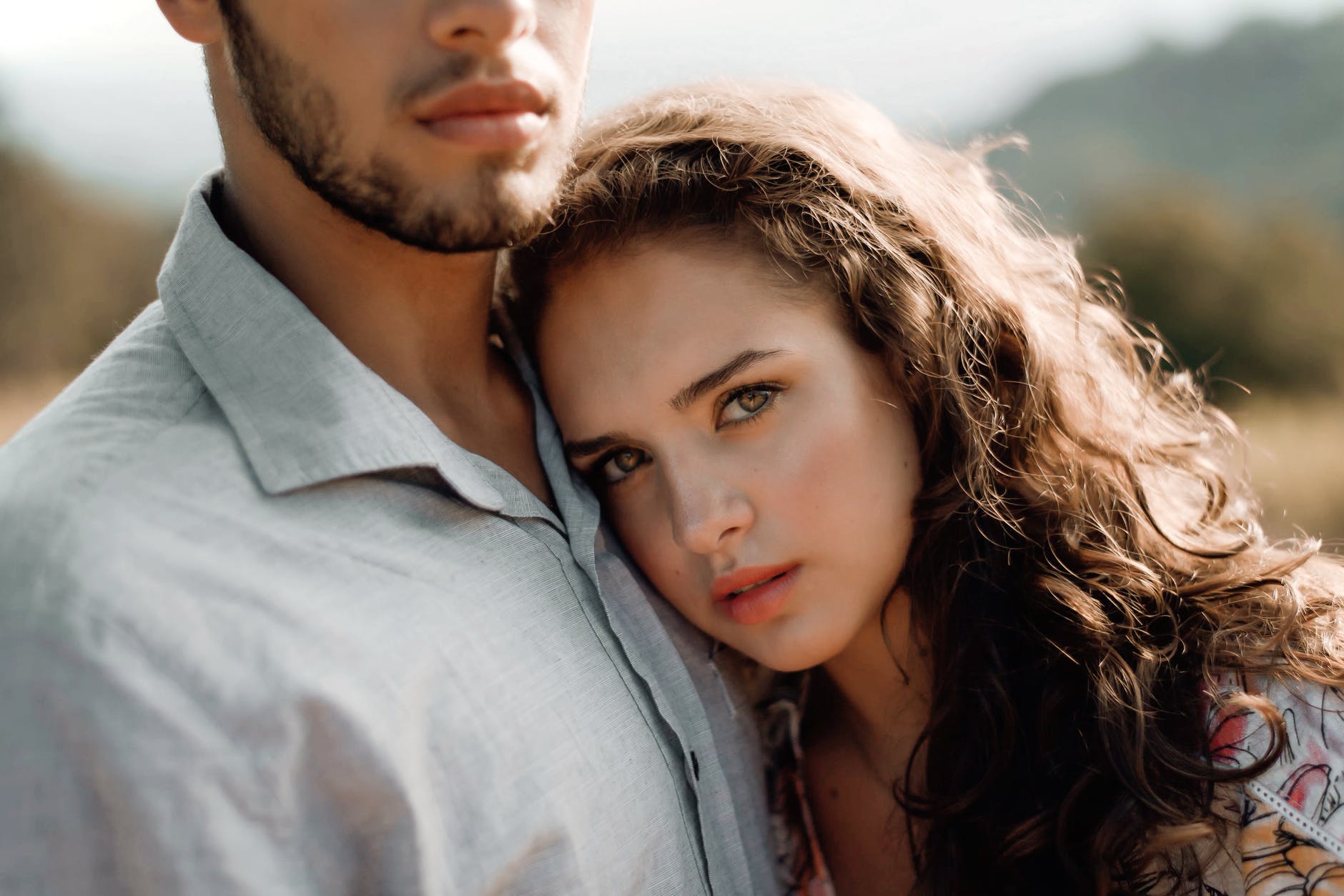 close up photo of woman leaning on man s chest